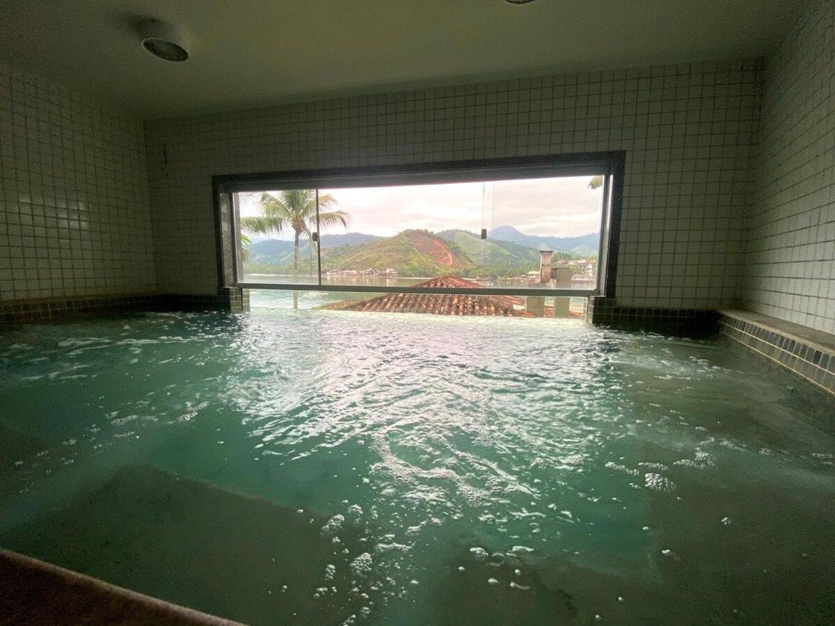 Condomínio com piscina, churrasqueira, sauna e MARINA P LANCHA - WiFi 200Mbps - 1qt e sala com 2 ar condicionados Angra dos Reis Exterior foto